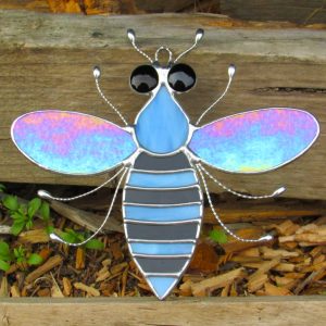 Stained glass Bee with iridescent wings, black and blue body and black eyes (L)
