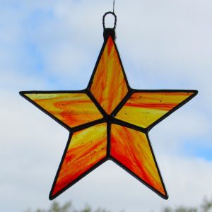 Stained Glass Star in amber and red streaky textured glass