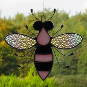Stained glass Bee with iridescent wings, pink and black body and black eyes